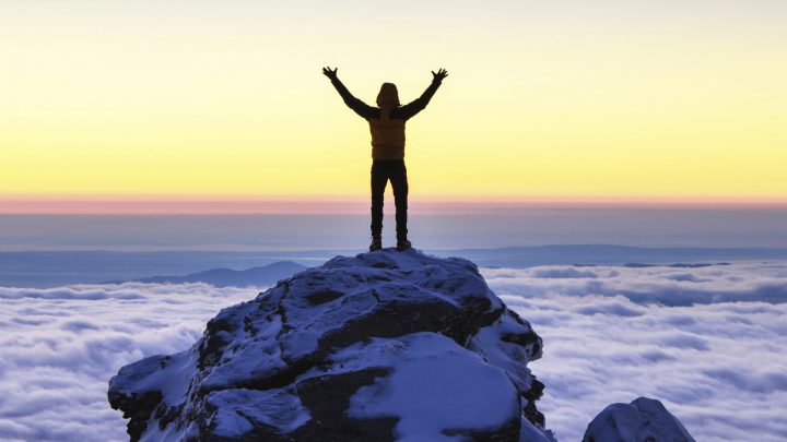 Man Exalting His Accomplishments on a Mountain Top