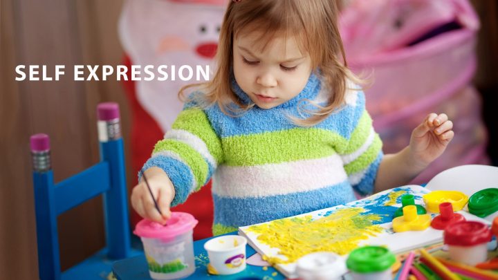Little Girl Painting and Expressing Herself Creatively